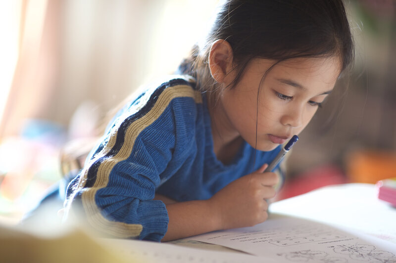 Child studying to improve test scores