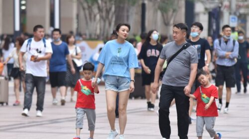 Family in China walking with children